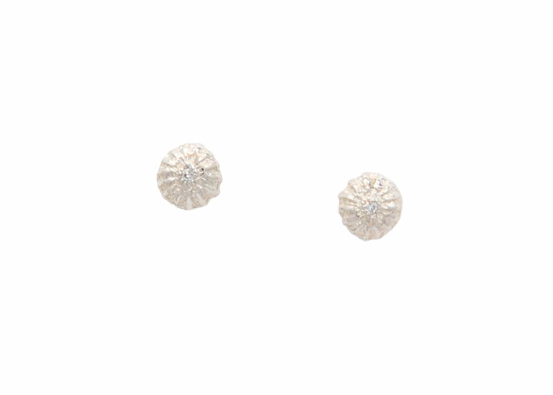 14k gold textured seed earrings with diamonds in center