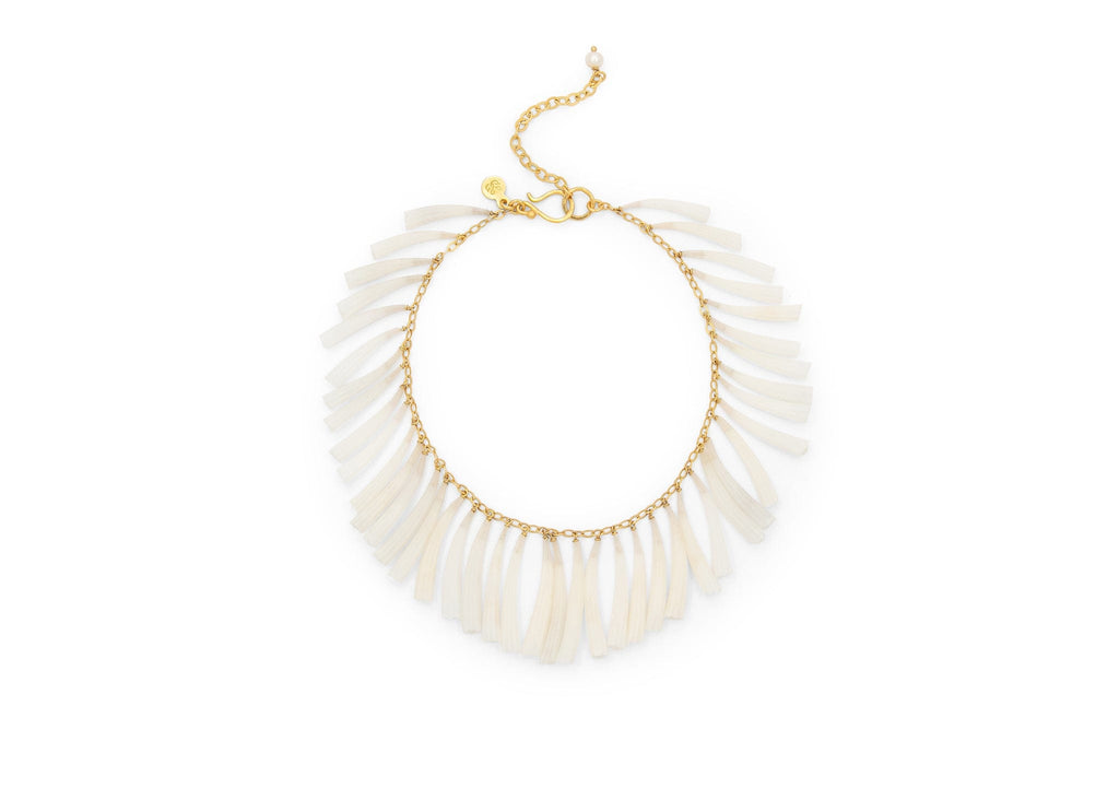 gold fringe style bracelet with slender white shells wire wrapped to chain