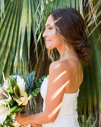 white shell earrings on bride