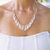 delicate white shell fringe necklace on beach wedding bride