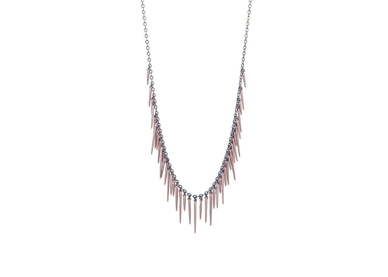 fringe style necklace with rose gold powder coated spikes and oxidized sterling silver