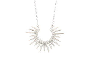 spiky white gold horseshoe shaped pendant with white diamonds