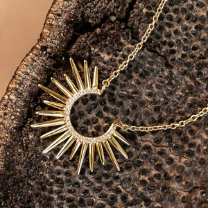 14k gold spiky urchin necklace with diamonds on shelf mushroom