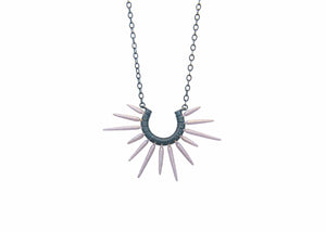 sea urchin inspired necklace with oxidized silver chain and rose gold powder coated spikes