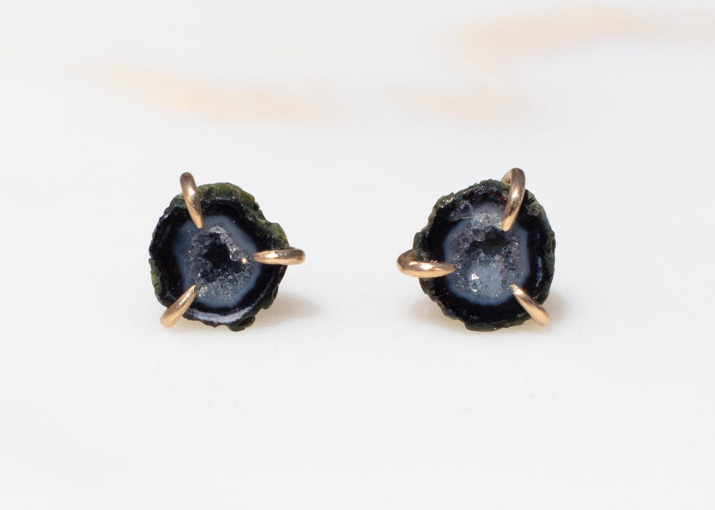 blue and black miniature tabasco geode earrings with gold claw setting