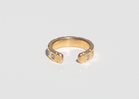 back of 14k gold ear cuff with diamonds and notched details