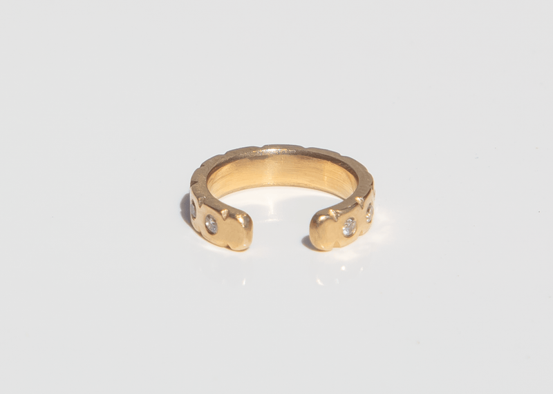 back of 14k gold ear cuff with diamonds and notched details