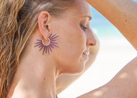 purple powder coated sea urchin spine hoop earrings on model