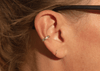 14k gold ear cuff with diamonds and notched details on ear