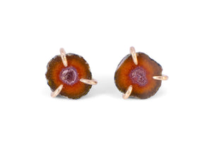 miniature orange tabasco geode stud earrings with gold claw setting