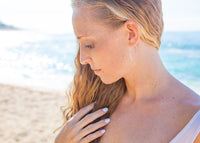 model wearing silver wire fish threader earrings