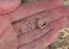 spiky yellow gold sea urchin earrings with diamonds underwater