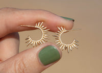 spiky yellow gold sea urchin earrings with diamonds