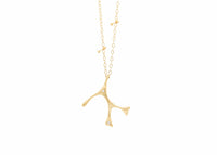 gold seaweed Necklace with diamonds and pin details in chain