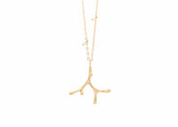 gold seaweed necklace with diamonds