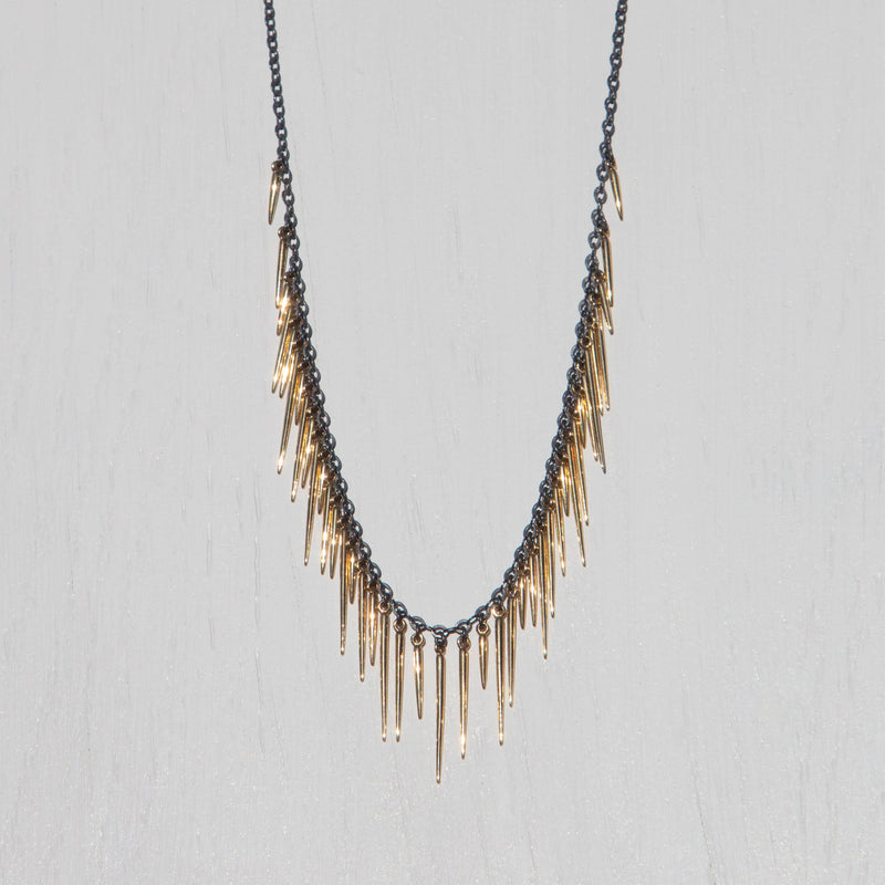oxidized silver fringe necklace with solid 14k gold spikes