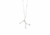sterling silver seaweed necklace with diamonds and barbell details in chain